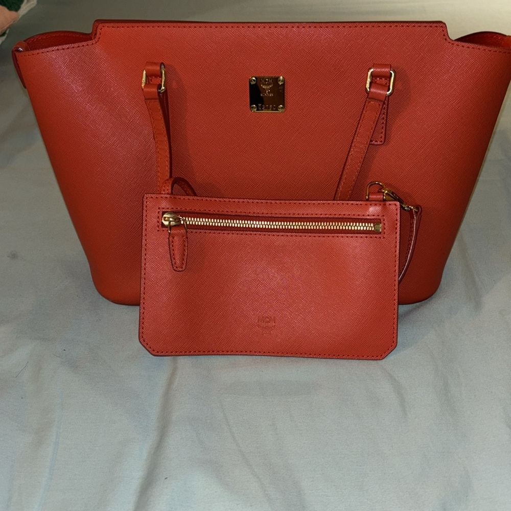 Red MCM bag. In used excellent condition.